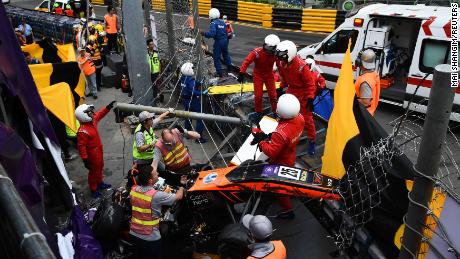 Race personnel and pit crew are seen at the accident site after Sophia Floersch, a German driver of Van Amersfoort Racing flew over the barriers and crashed into a photographers&#39; bunker at high speed, during a Formula Three race at the Macau Grand Prix, in Macau, China November 18, 2018. Mai Shangmin/CNS via REUTERS ATTENTION EDITORS - THIS IMAGE WAS PROVIDED BY A THIRD PARTY. CHINA OUT.