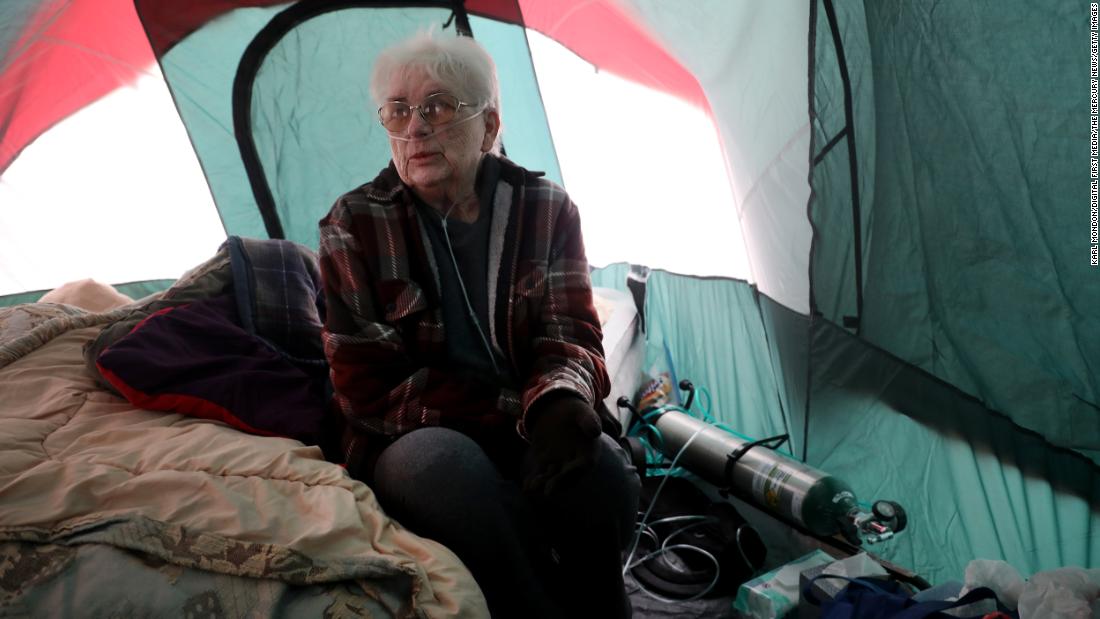 Jackie Wineland, 74, uses her oxygen tank in a tent on Tuesday, November 13.