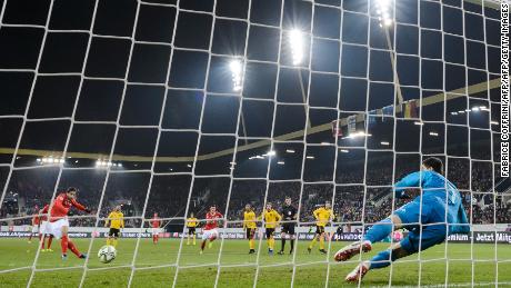 Swiss defender Ricardo Rodriguez shoots from the penalty spot to score his team's first goal against Belgium.