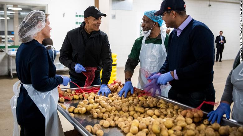 Obama Helps Prepare Thanksgiving Meal Bags In Surprise Visit To