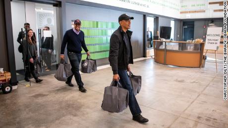 Obama Helps Prepare Thanksgiving Meal Bags In Surprise Visit To