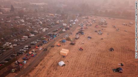Evacuees from the Camp Fire shelter in tents outside the Walmart in Chico, California.