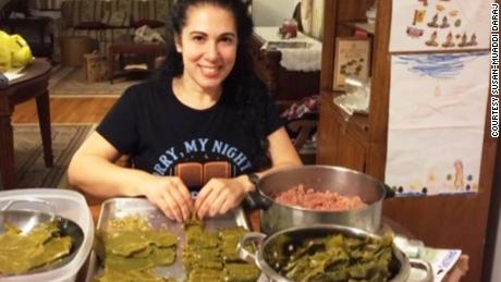 Susan Muaddi-Darraj works on stuffing grape leaves.