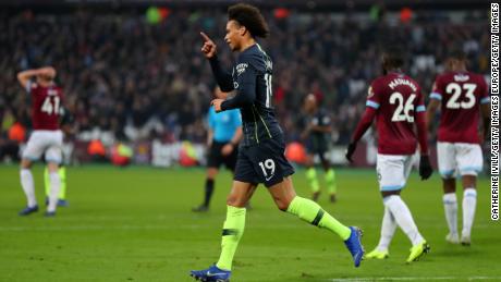 Man City's Leroy Sane celebrates after scoring his team's third goal.