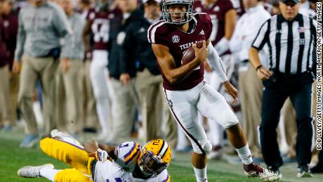 Texas A&M quarterback Kellen Mond slips the tackle attempt by LSU's JaCoby Stevens in the first half.