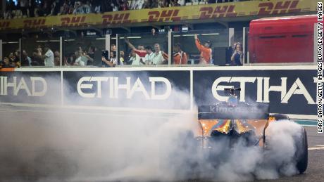 Fernando Alonso performs doughnuts after his final Grand Prix.