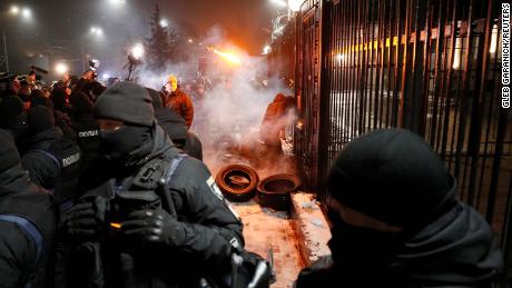 Protesters gather outside the Russian embassy in Kiev on Saturday evening. 