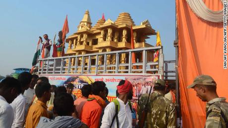 Indian people watch a model of the Ram temple during the &#39;Dharam Sabha&#39; Hindu congregation held to call for the construction of a grand temple of Lord Rama, in Ayodhya on November 25, 2018. - Hindu groups claim deity Rama was born and a temple existed at the site of a medieval Mosque that was demolished by Hindu mobs in 1992, triggering religious riots that left some 2,000 people dead across India. The more than a century-old dispute over the site has been a frequent  flashpoint between majority Hindus and minority Muslims. (Photo by SANJAY KANOJIA / AFP)        (Photo credit should read SANJAY KANOJIA/AFP/Getty Images)