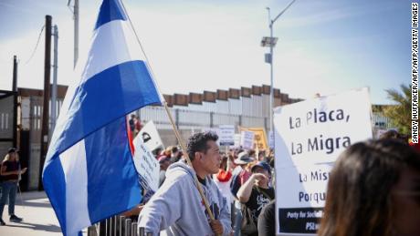 Migrants may have to wait 6 weeks at border to claim asylum, official says