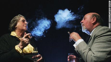 Baroness Trumpington (left) smoking a cigar with Lord Pendry in 2006