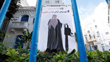 A banner depicting an image of Saudi Crown Prince Mohammed bin Salman holding a chainsaw, is seen near the Union of Tunisian Journalists headquarters in Tunis, Tunisia. 