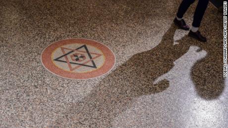 A member of Berlin&#39;s Jewish Community walks past the Star of David inside the Synagogue Rykestrasse in Berlin prior to a ceremony on November 9, 2018 to commemorate the 80th anniversary of the Kristallnacht Nazi pogrom. - Germany remembers victims of the Nazi pogrom that heralded the start of the Third Reich&#39;s drive to wipe out Jews, at a time when anti-Semitism is resurgent in the West. (Photo by Tobias SCHWARZ / AFP)        (Photo credit should read TOBIAS SCHWARZ/AFP/Getty Images)
