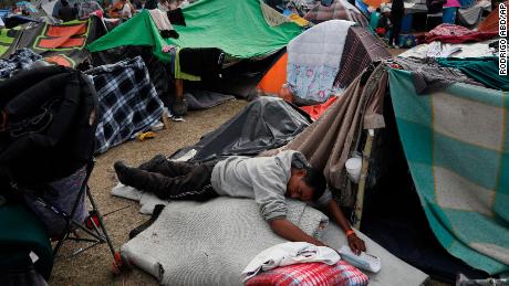 A man naps at the Benito Juarez Sports Complex. 