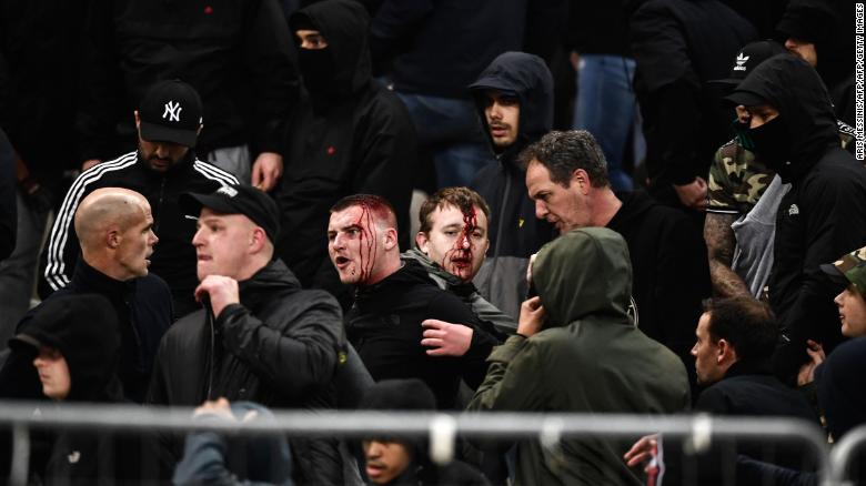 Ajax supporters were left bloodied in clashes before the team&#39;s game at AEK Athens in the Champions League. 