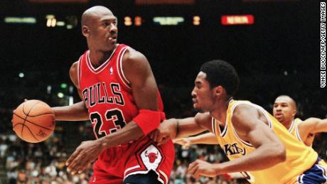 LOS ANGELES, UNITED STATES:  Michael Jordan of the Chicago Bulls (L) eyes the basket as he is guarded by Kobe Bryant of the Los Angeles Lakers during their 01 February game in Los Angeles, CA. Jordan will appear in his 12th NBA All-Star game 08 February while Bryant will make his first All-Star appearance. The Lakers won the game 112-87.  AFP PHOTO/Vince BUCCI (Photo credit should read Vince Bucci/AFP/Getty Images)