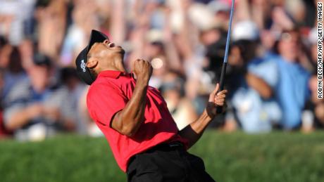 Tiger Woods celebrates his birdie putt on the 18th hole to force a playoff with Rocco Mediate.