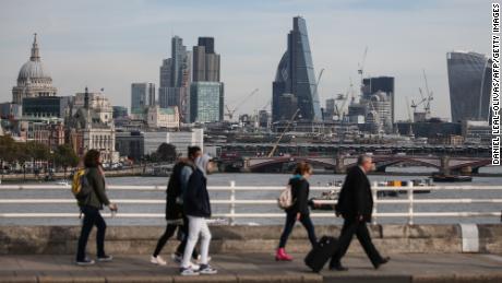 Pedestrians waling through Waterloo Bridge with the skyline of the City of London in the background on October 27, 2016. 
Britain&#39;s economy won a double boost on October 27 on news of faster-than-expected growth following its vote for Brexit and a pledge by Nissan to build new car models in the UK. Gross domestic product expanded by 0.5 percent in the third quarter, official data showed.
 / AFP / Daniel Leal-Olivas        (Photo credit should read DANIEL LEAL-OLIVAS/AFP/Getty Images)