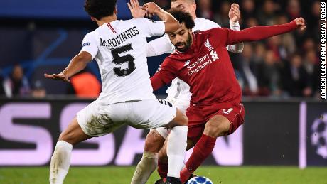 Liverpool talisman Mo Salah, right, was kept quiet against PSG. 