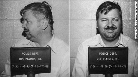 Serial killer John Wayne Gacy poses for December 1978 mugshot at the Des Plaines Police Department.