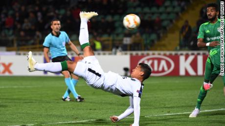 Sporting Lisbon's Colombian forward Freddy Montero acrobatically kicks the ball in the game against Vorskla.