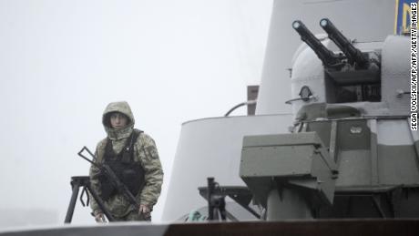 Ukrainian soldier patrols aboard military boat called "Dondass" moored in Mariupol, Sea of Azov port on November 27, 2018. 