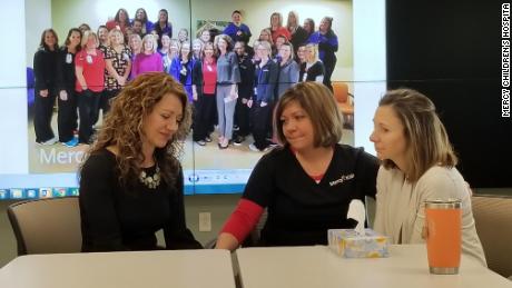 Stephanie Brinkman (middle) organized a lottery pool for the NICU staff at Mercy Children's Hospital in the St. Louis area. When the group won $10,000, they decided to give the cash to Gretchen Post (left), whose 17-year-old son died by suicide the night of the drawing, and to Casey Orellana (right), whose husband is battling cancer.