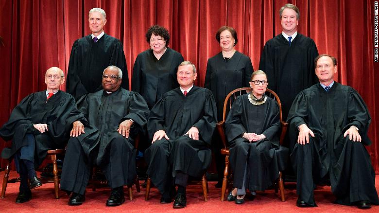 Justices of the US Supreme Court pose for their official photo at the Supreme Court in Washington, DC on November 30, 2018. - Standing from left: Associate Justice Neil Gorsuch, Associate Justice Sonia Sotomayor, Associate Justice Elena Kagan and Associate Justice Brett Kavanaugh.Seated from left to right, bottom row: Associate Justice Stephen Breyer, Associate Justice Clarence Thomas, Chief Justice John  Roberts, Associate Justice Ruth Bader Ginsburg and Associate Justice Samuel Alito. (Photo by MANDEL NGAN / AFP)        (Photo credit should read MANDEL NGAN/AFP/Getty Images)