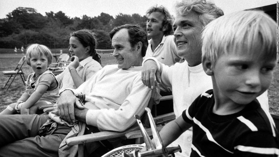 Bush sits with members of his family in 1971. He met his wife at a country club dance in 1941, and they were married in 1945. They had six children.