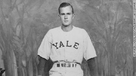 George H. W. Bush standing in front of a &quot;Yale Fence&quot; in his baseball uniform at Yale University, circa 1945-48. (George Bush Presidential Library/MCT via Getty Images)