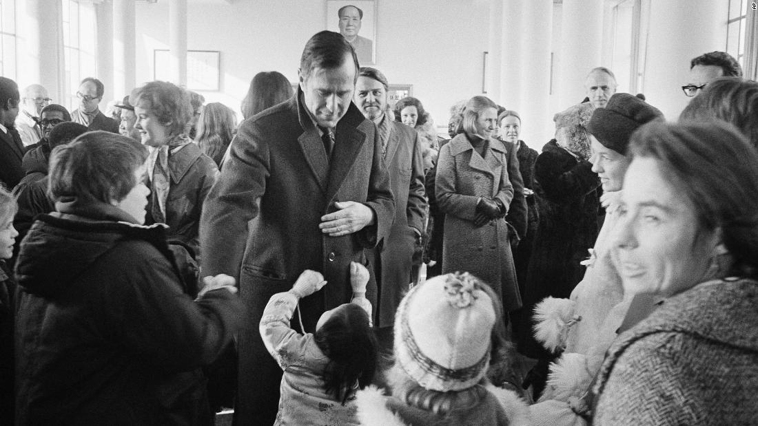 Under President Gerald Ford, Bush served as the chief liaison to China in 1975. Here, Bush greets well-wishers in Beijing.