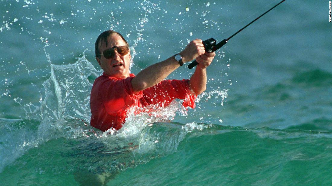 Shortly after winning the election, Bush casts a line while surf fishing in Gulf Stream, Florida. 