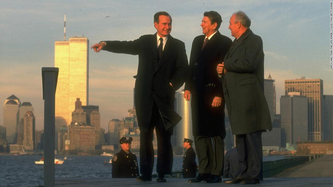 Soviet leader Mikhail Gorbachev takes in the New York skyline with Reagan and Bush in 1988.