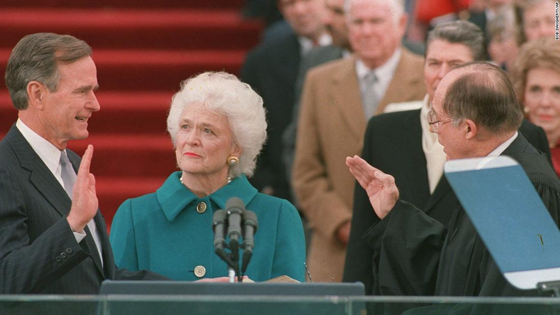 Bush was sworn into office as the 41st president of the United States on January 20, 1989. First lady Barbara Bush holds the Bible for her husband while Chief Justice William Rehnquist administers the oath of office.