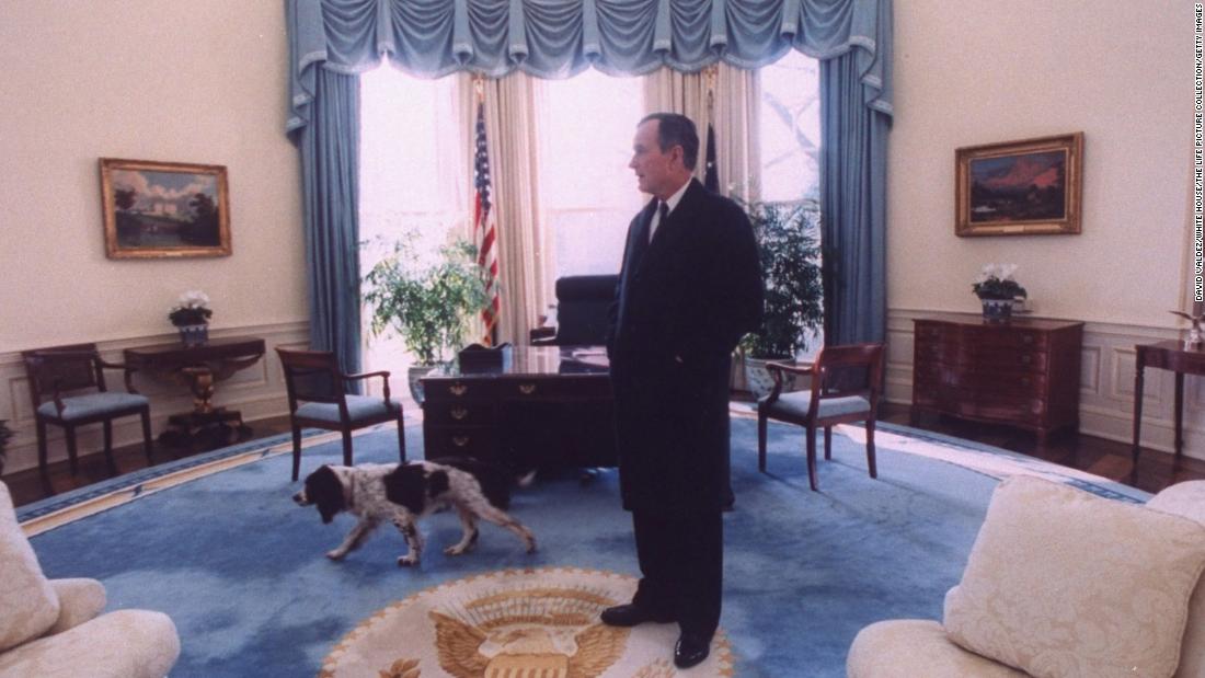 Bush takes a last look around the Oval Office with his dog, Ranger, before vacating the White House for Bill Clinton.