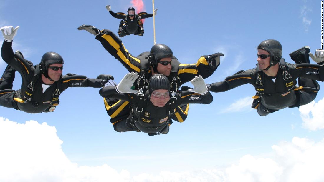 Celebrating his 80th birthday in 2004, Bush performs one of two skydiving jumps he completed with the Army Golden Knights.