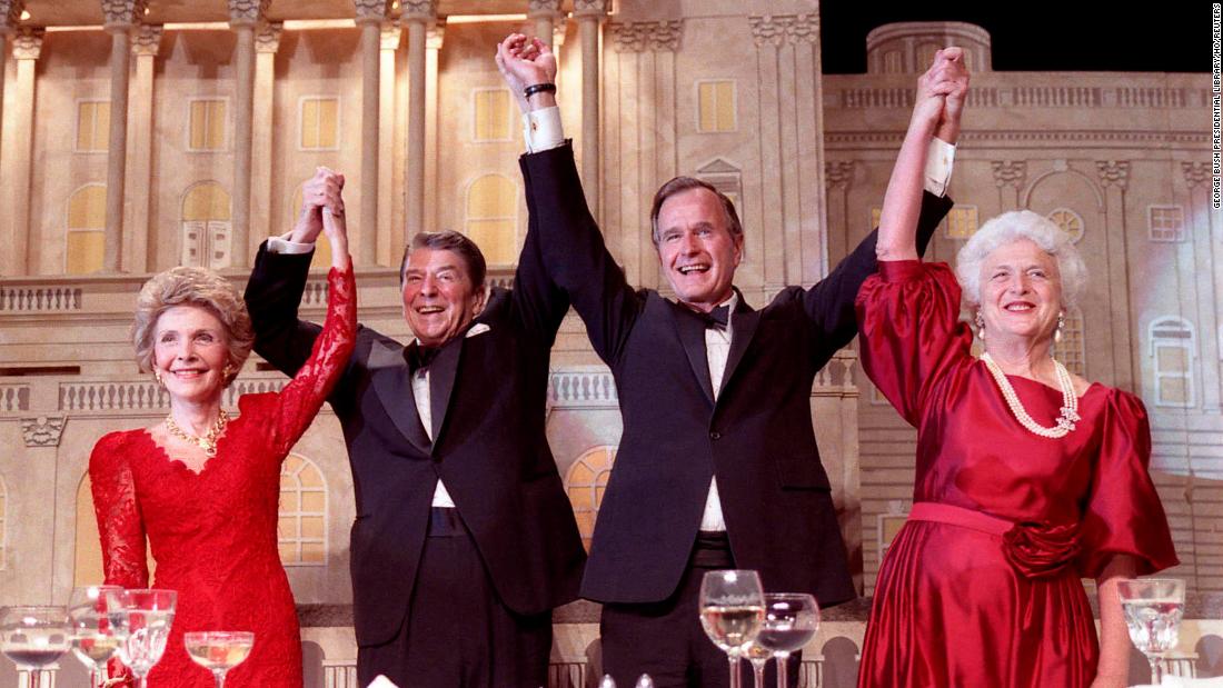 The Reagans and the Bushes join hands after President Reagan endorsed Bush&#39;s presidential run at a dinner in 1988.