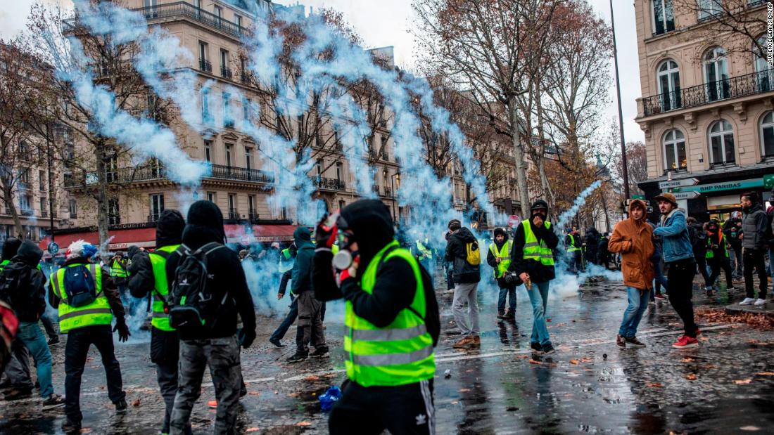 Protesters and police clash in downtown Paris on December 1 during a national demonstration.