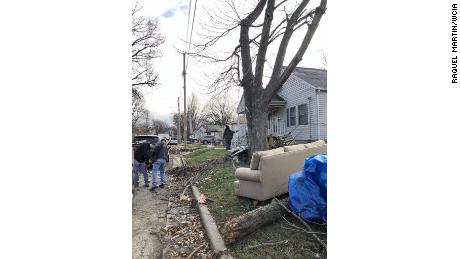 Taylorville neighbors go through the debris after the storm.