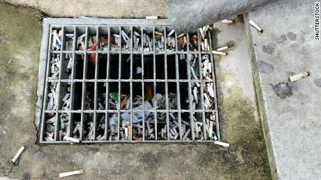 Cigarette butts collect in drains and are washed into waterways.