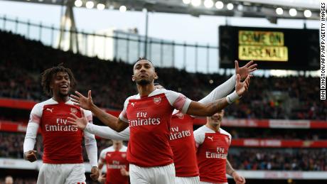 Arsenal&#39;s Pierre-Emerick Aubameyang celebrates after scoring the opening goal from the penalty spot during Arsenal&#39;s EPL encounter with Tottenham Hotspur at the Emirates Stadium.