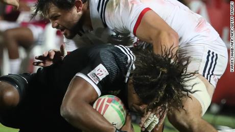 New Zealand's Luke Masirewa is tackled by USA's Ben Pinkelman.