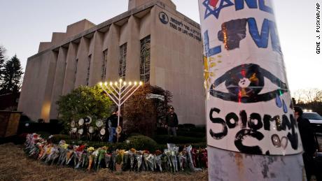 A menorah is lit outside the Tree of Life Synagogue in preparation for a service on the first night of Hanukkah, December 2, in the Squirrel Hill neighborhood of Pittsburgh.