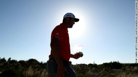 Rahm walks to the 15th fairway during the final round on Sunday.