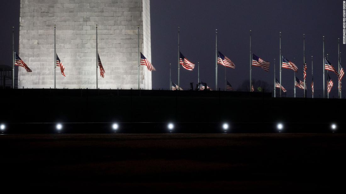 Flags at the Washington Monument fly at half-staff to pay tribute to Bush on Saturday, December 1.