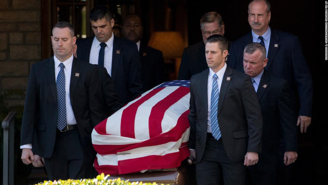 Pallbearers carry Bush&#39;s casket out of the Houston funeral home.