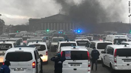 Paramedics join anti-government protests outside the National Assembly in Paris.