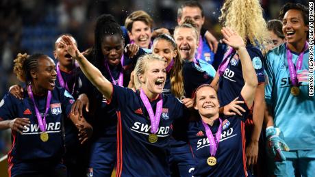 Ada Hegerberg celebrates Lyon's third successive Champions League title after a 4-1 in over Wolfsburg