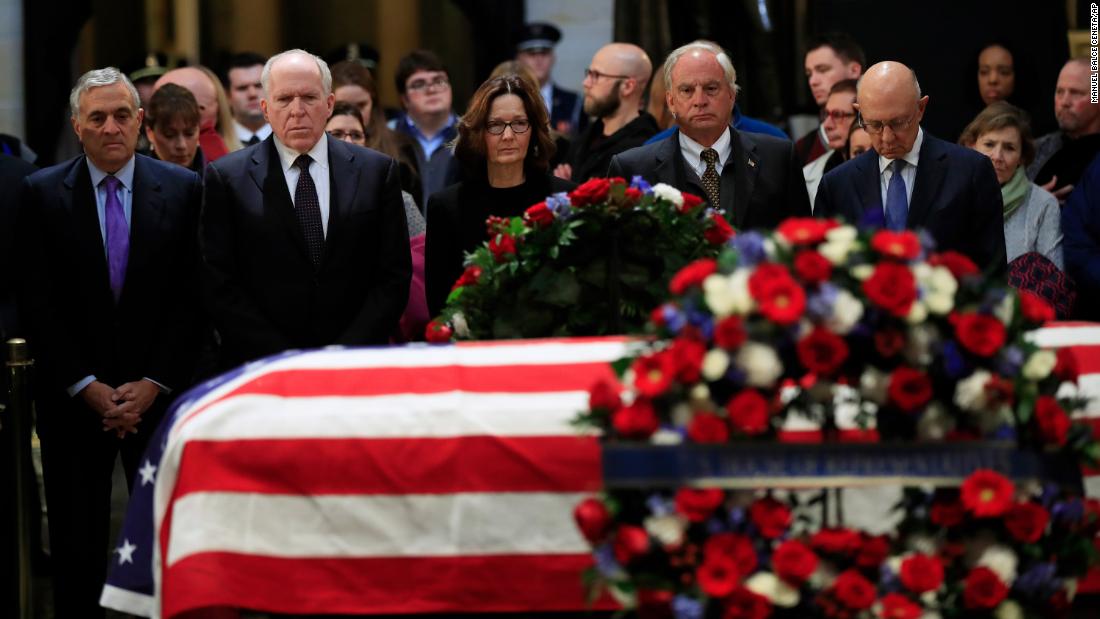 CIA Director Gina Haspel and former CIA directors -- from left, George Tenet, John Brennan, Porter Goss and James Woolsey -- say goodbye to Bush on December 4. Bush was director of Central Intelligence in the late 1970s.