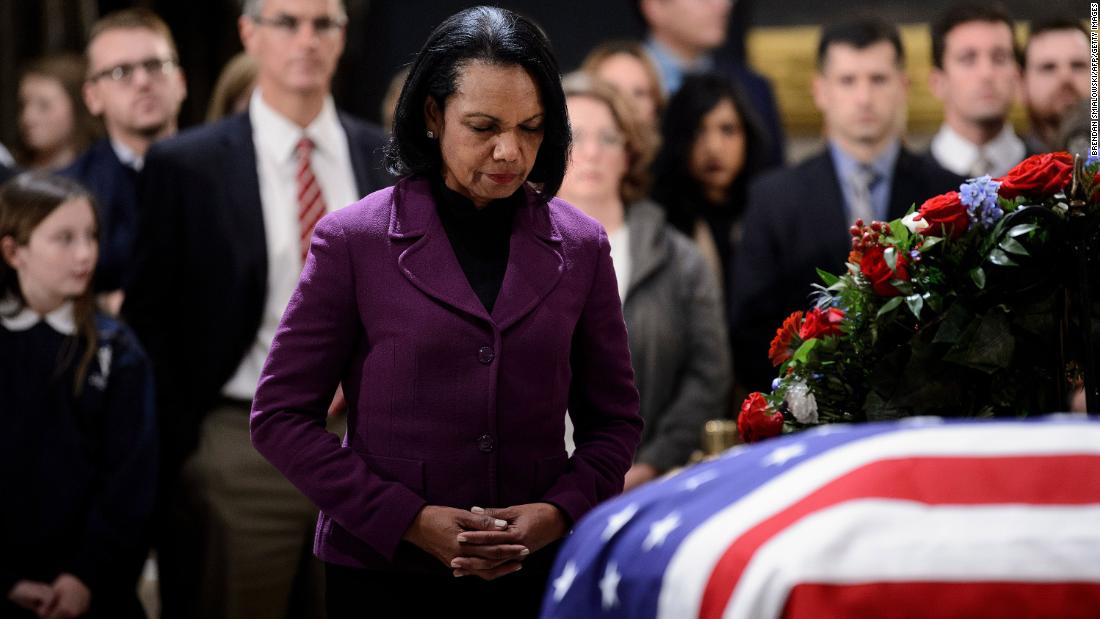Former Secretary of State Condoleezza Rice pays her respects on December 4.