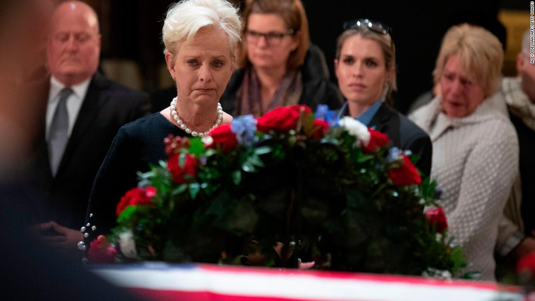 Cindy McCain, widow of the late US Sen. John McCain, stops by Bush&#39;s casket.